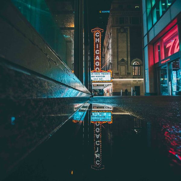 Bright neon light reflecting on a sweaty forehead after exercise.