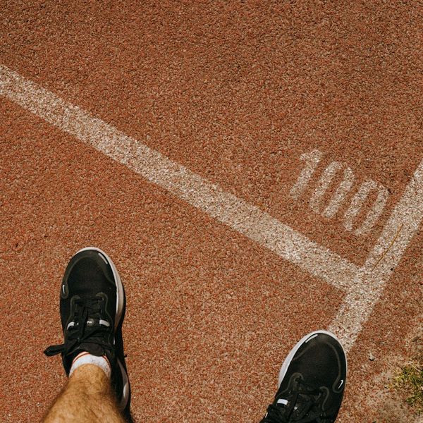 Close up of sports shoes hitting the ground during cardio.